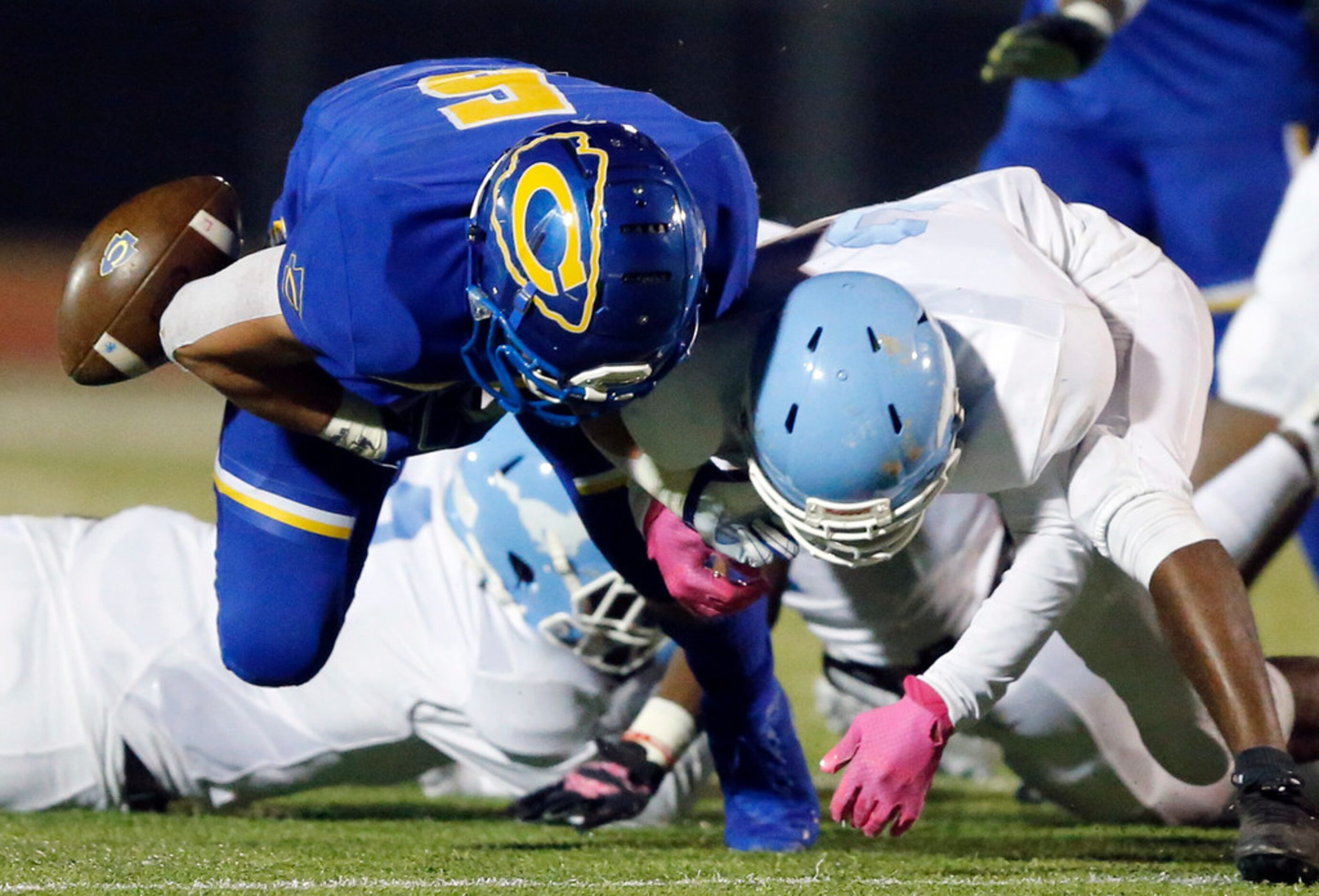 Dallas Roosevelt cornerback Cedrick Webb (2, right) forces Community High running back Tyson...