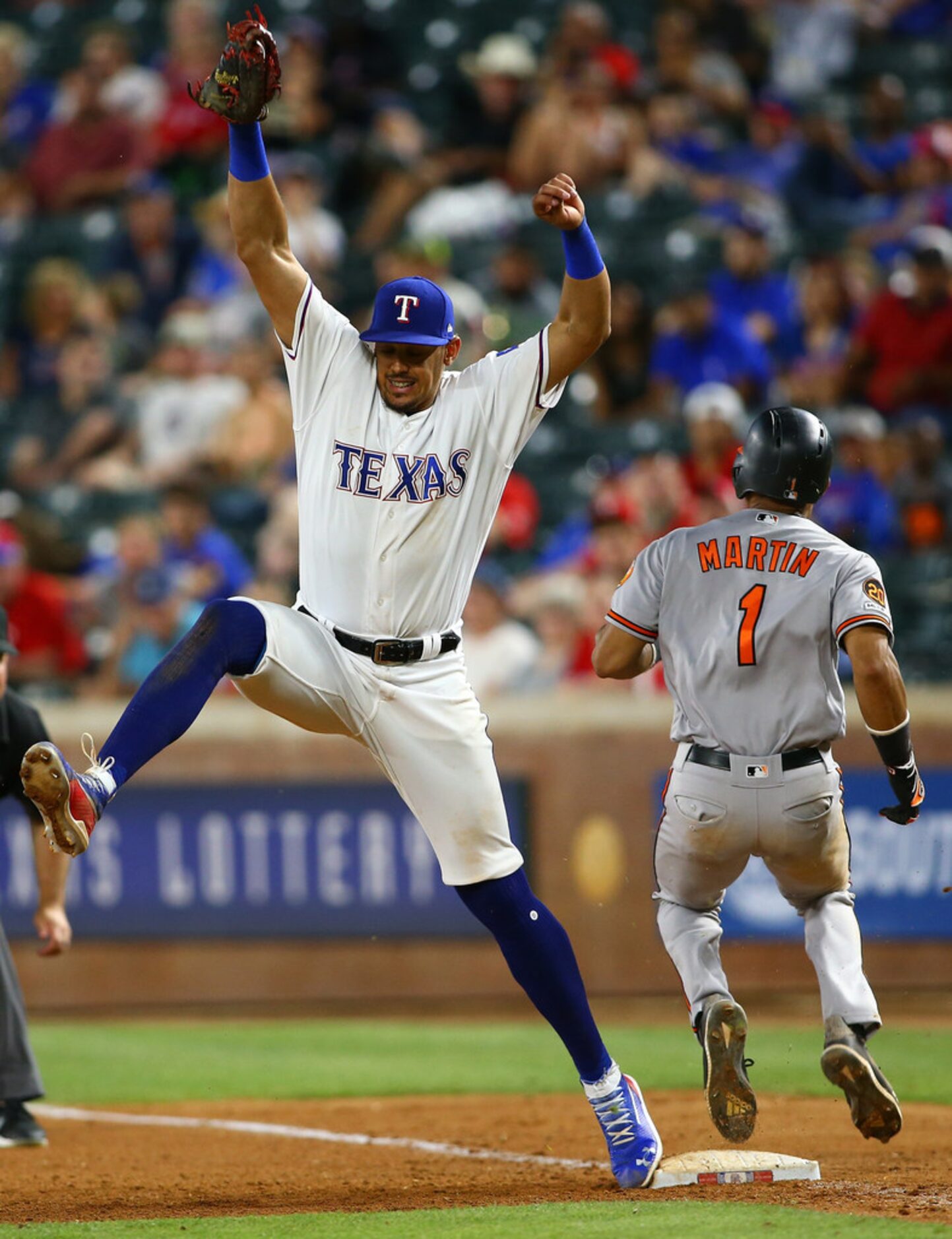 ARLINGTON, TX - JUNE 04: Ronald Guzman #11 of the Texas Rangers stretches to catch the force...