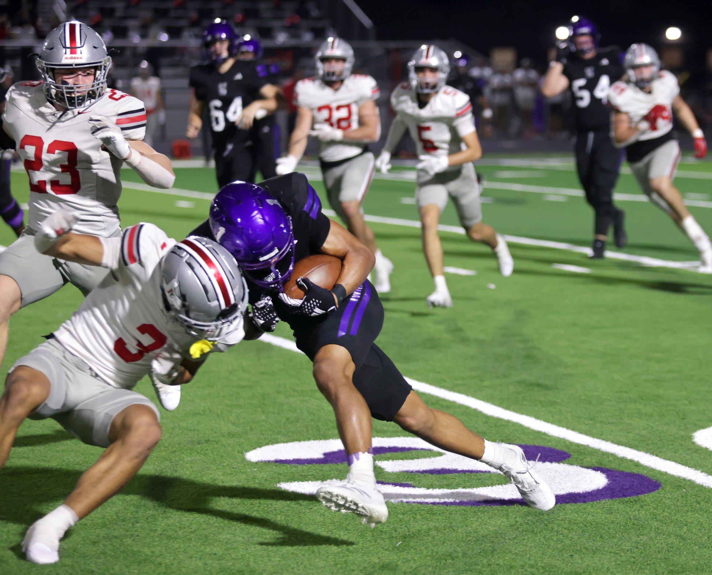 Lovejoy player #3 RJ McIntosh stops Anna player #1 Edward Chumley during the  Lovejoy High...