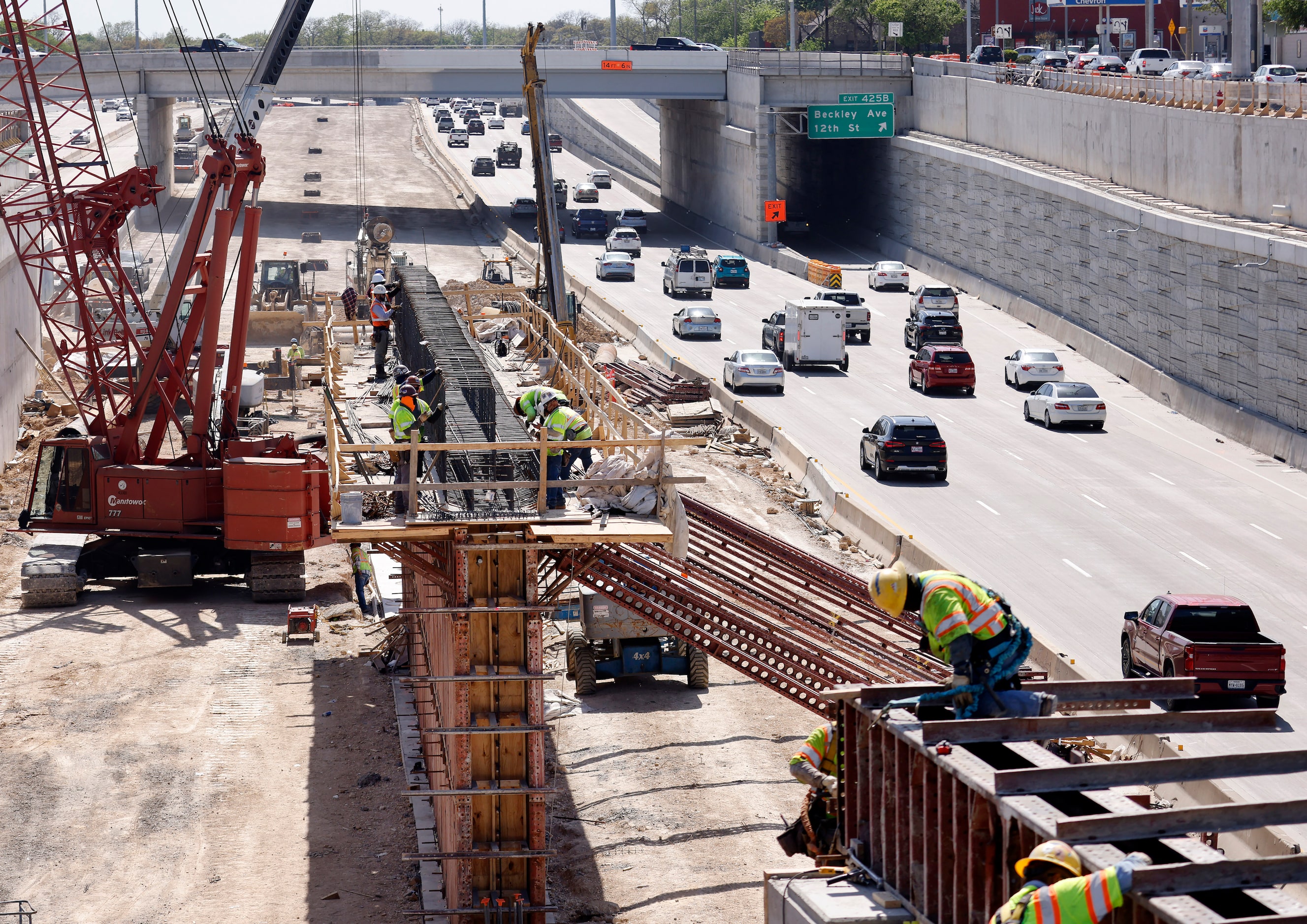 Crews construct support structures for the $172 million Southern Gateway Park on Interstate...