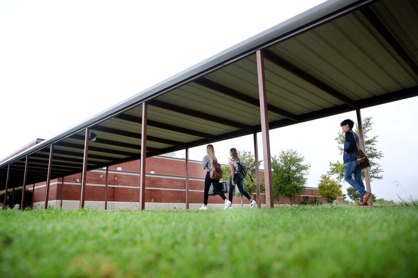 Students headed to class in Commerce on Monday.