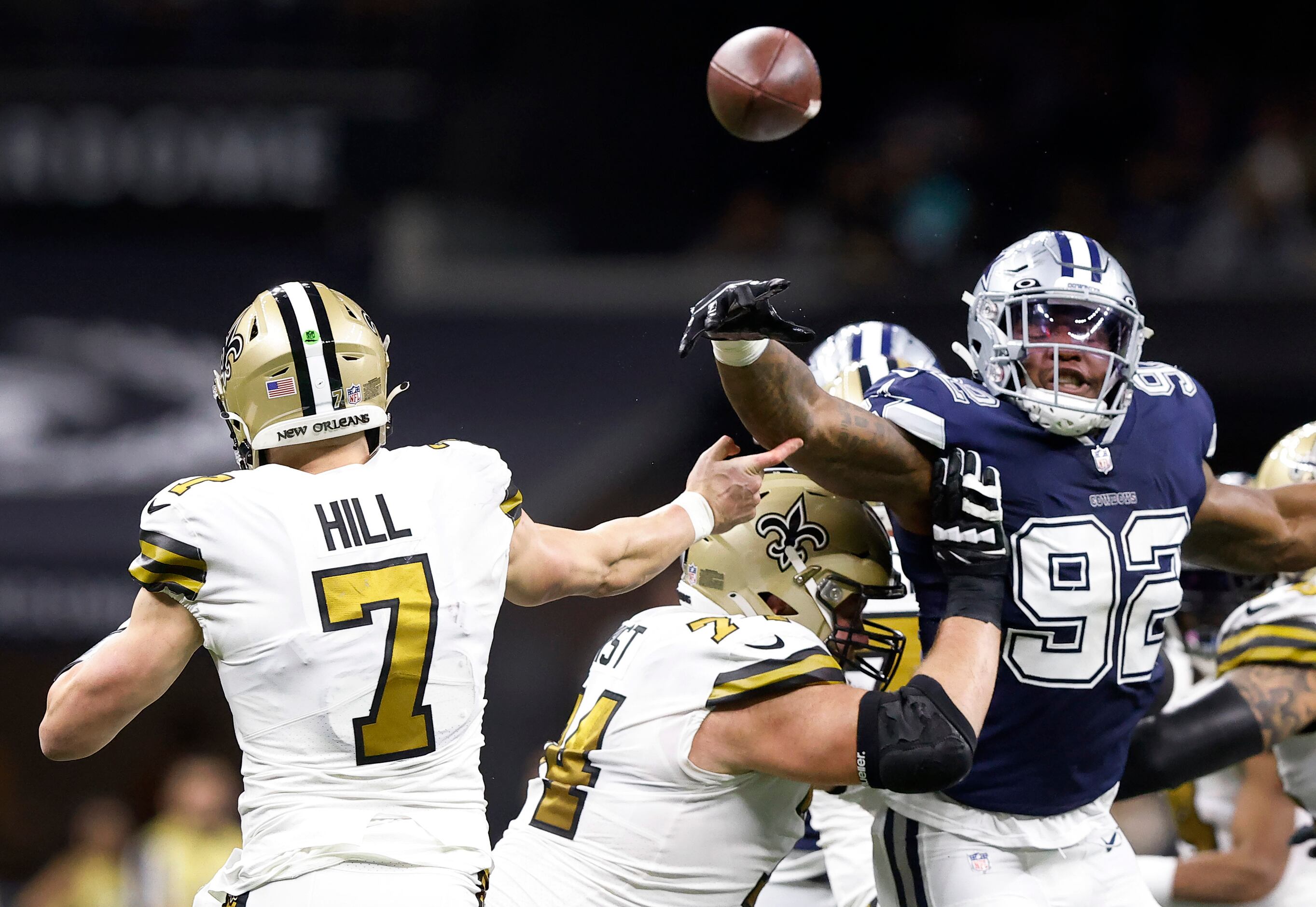 New Orleans Saints quarterback Taysom Hill (7) hits his hand on Dallas Cowboys defensive end...