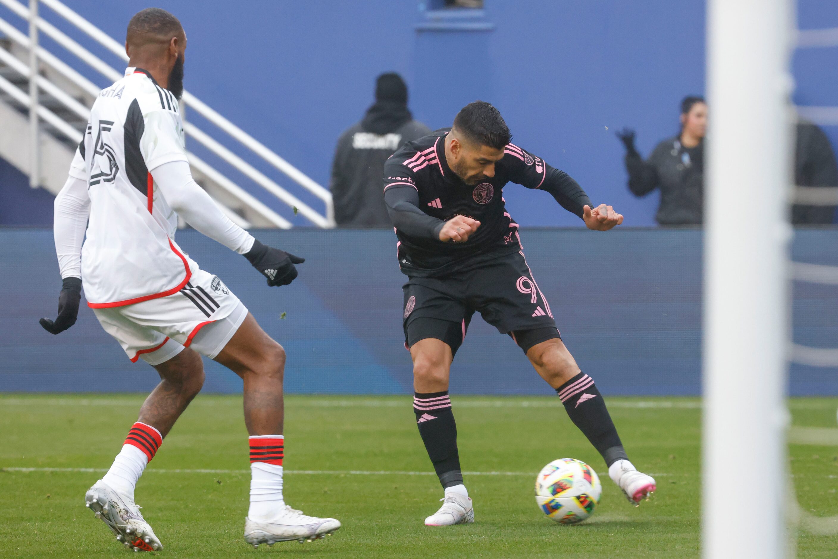 FC Dallas defender Sebastien Ibeagha (left) looks to block a cross of Inter Miami forward...