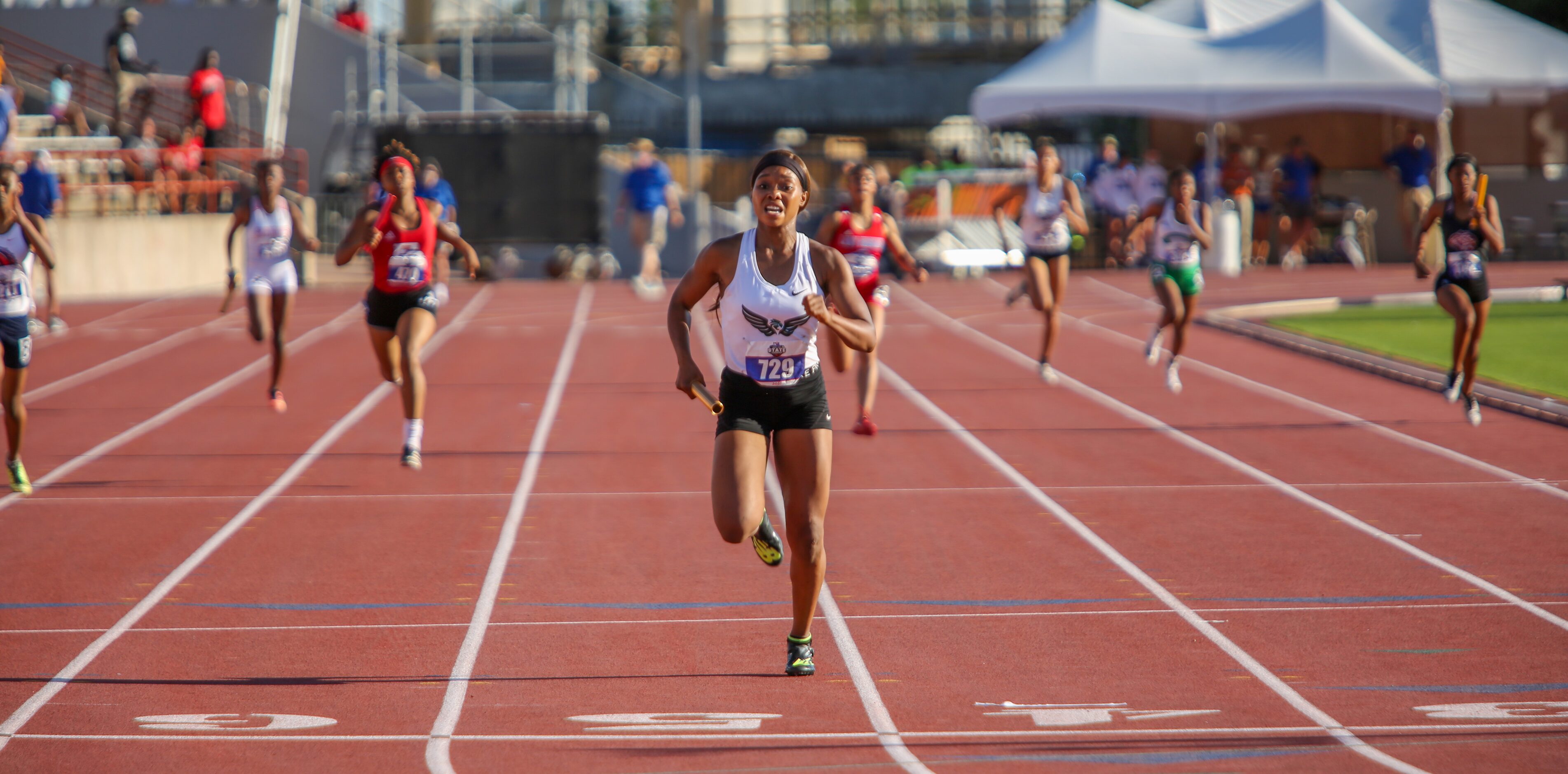 Kennedale's Brianna Brand runs into the finish line during the 4A girls 4x200 relay event at...