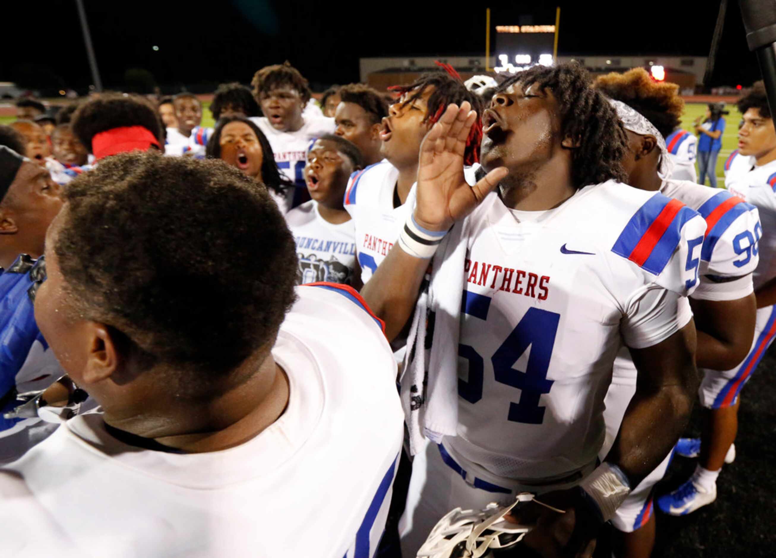 Duncanville's Savion Byrd (54) and his teammates howl after defeating Lancaster, 24-3, at...