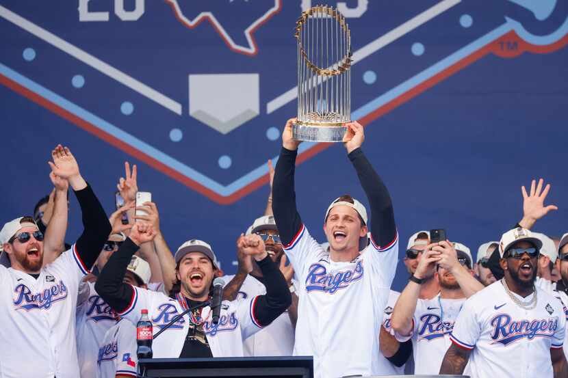 Texas Rangers’ Corey Seager hoists the Commissioner's Trophy during Texas Rangers World...