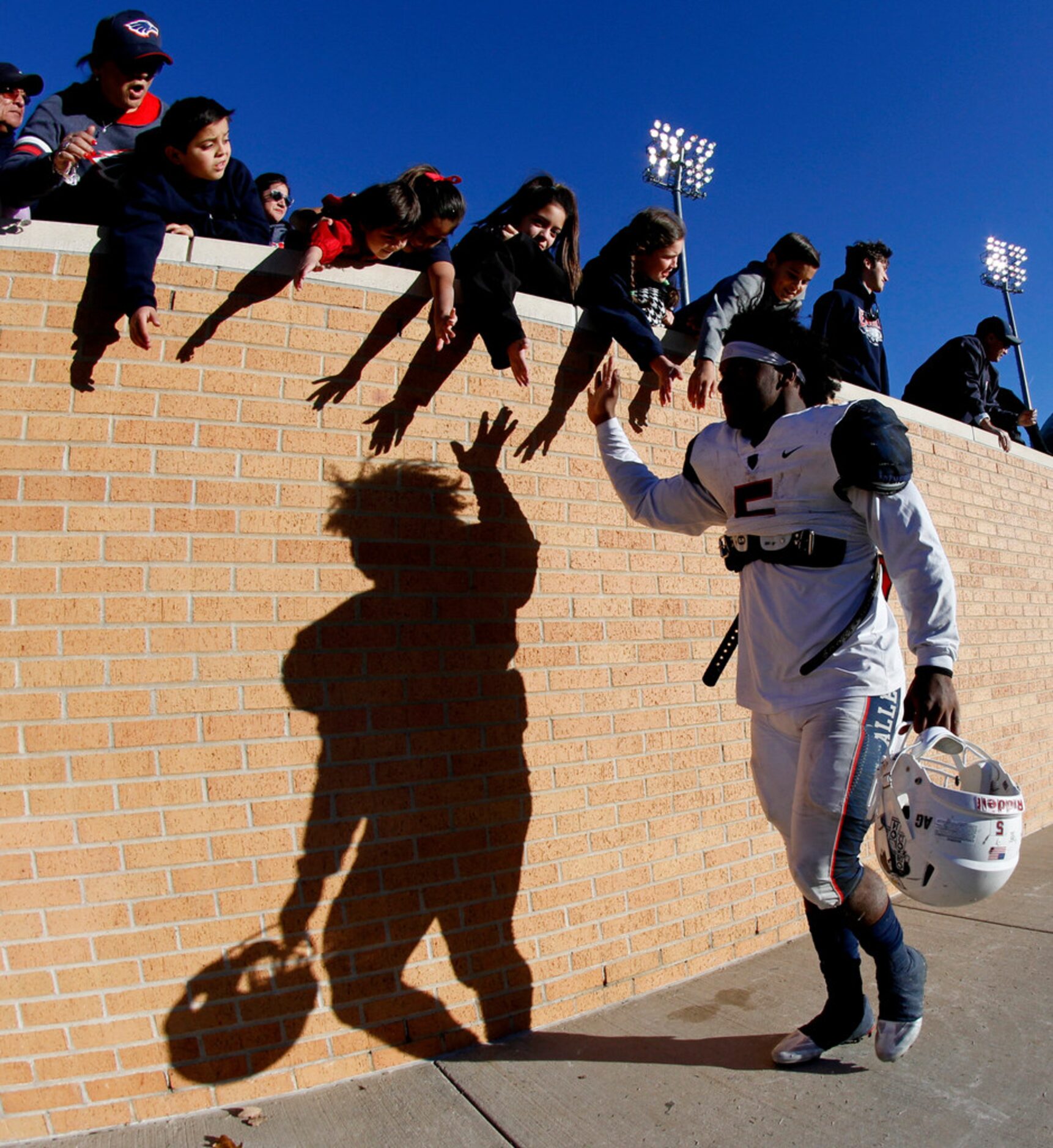 Accompanied only by his shadow, Allen eagles running back was far from alone as he was...