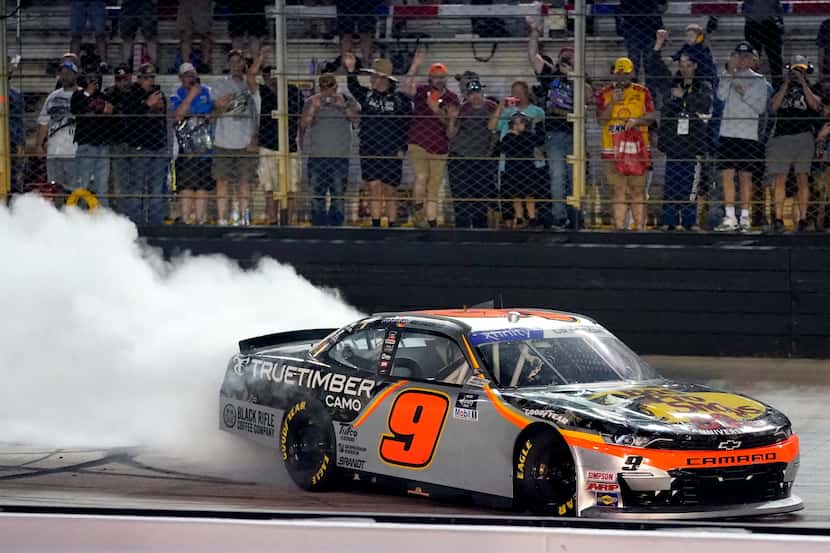 Noah Gragson does a burnout after winning a NASCAR Xfinity Series auto race at Bristol Motor...