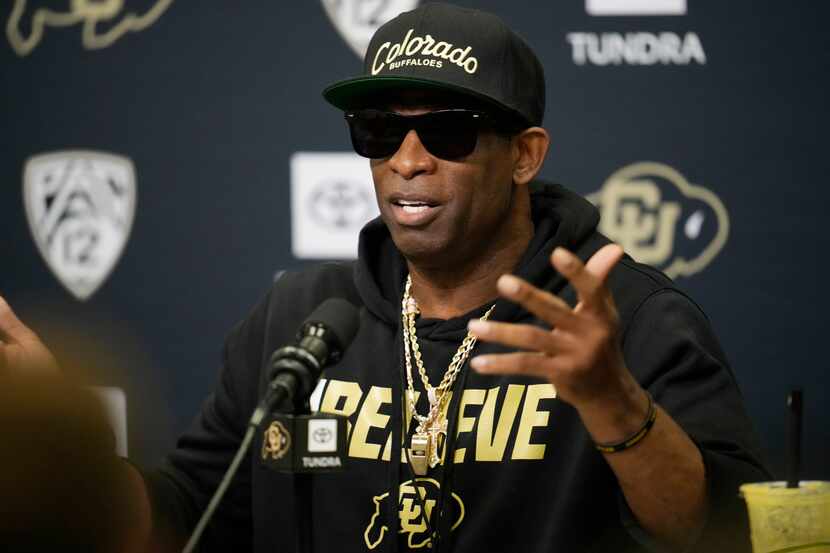 Colorado head coach Deion Sanders responds to questions during a news conference after the...