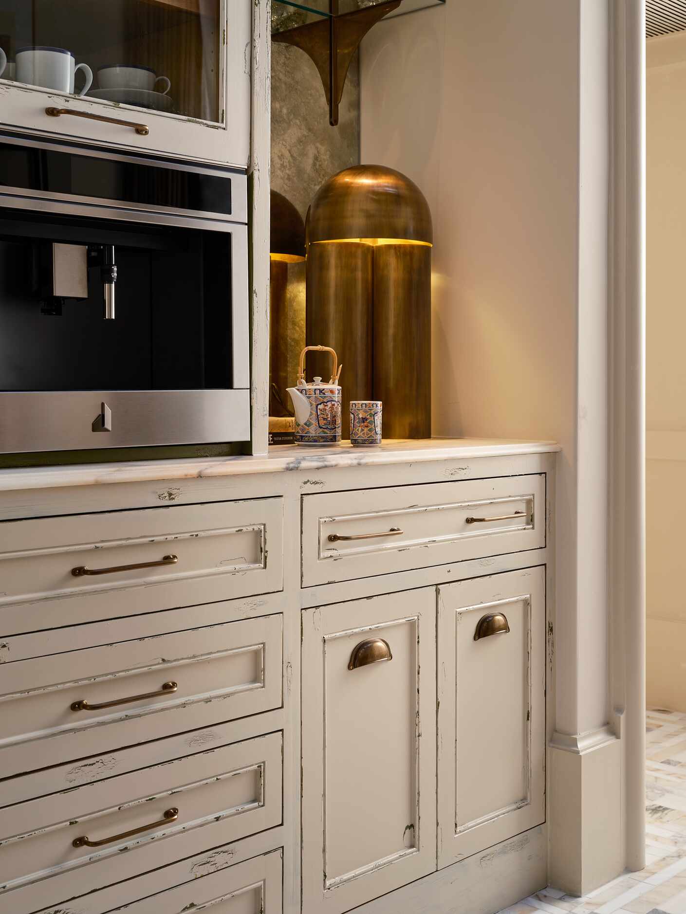 Pictured is a designated coffee bar, with ample storage in the cabinetry underneath.