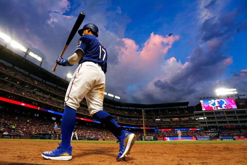 Texas Rangers left fielder Shin-Soo Choo (17) leads off against the Houston Astros rain...