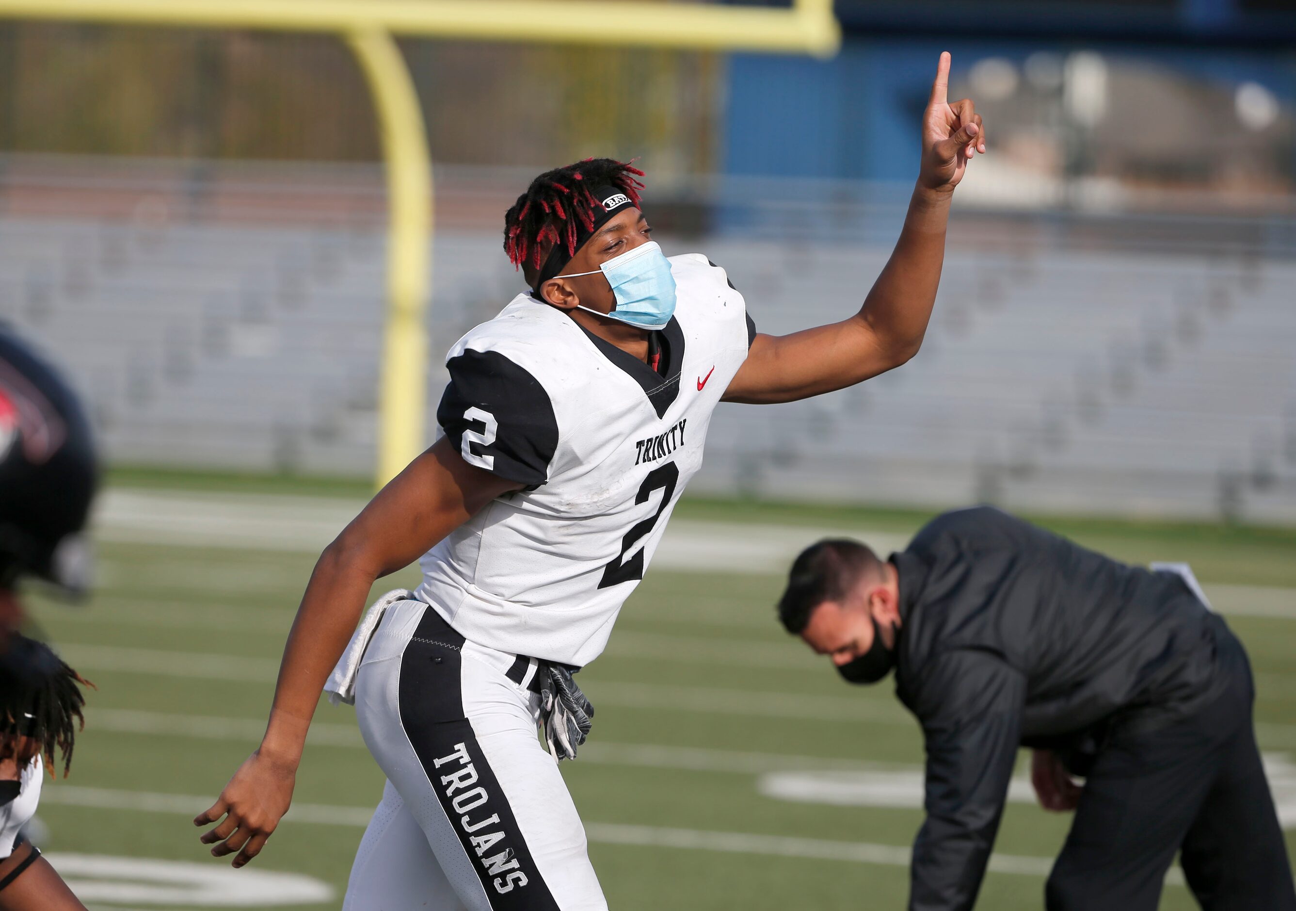 Euless Trinity running back Ollie Gordon (2) celebrates after they defeated Haltom 56-10...