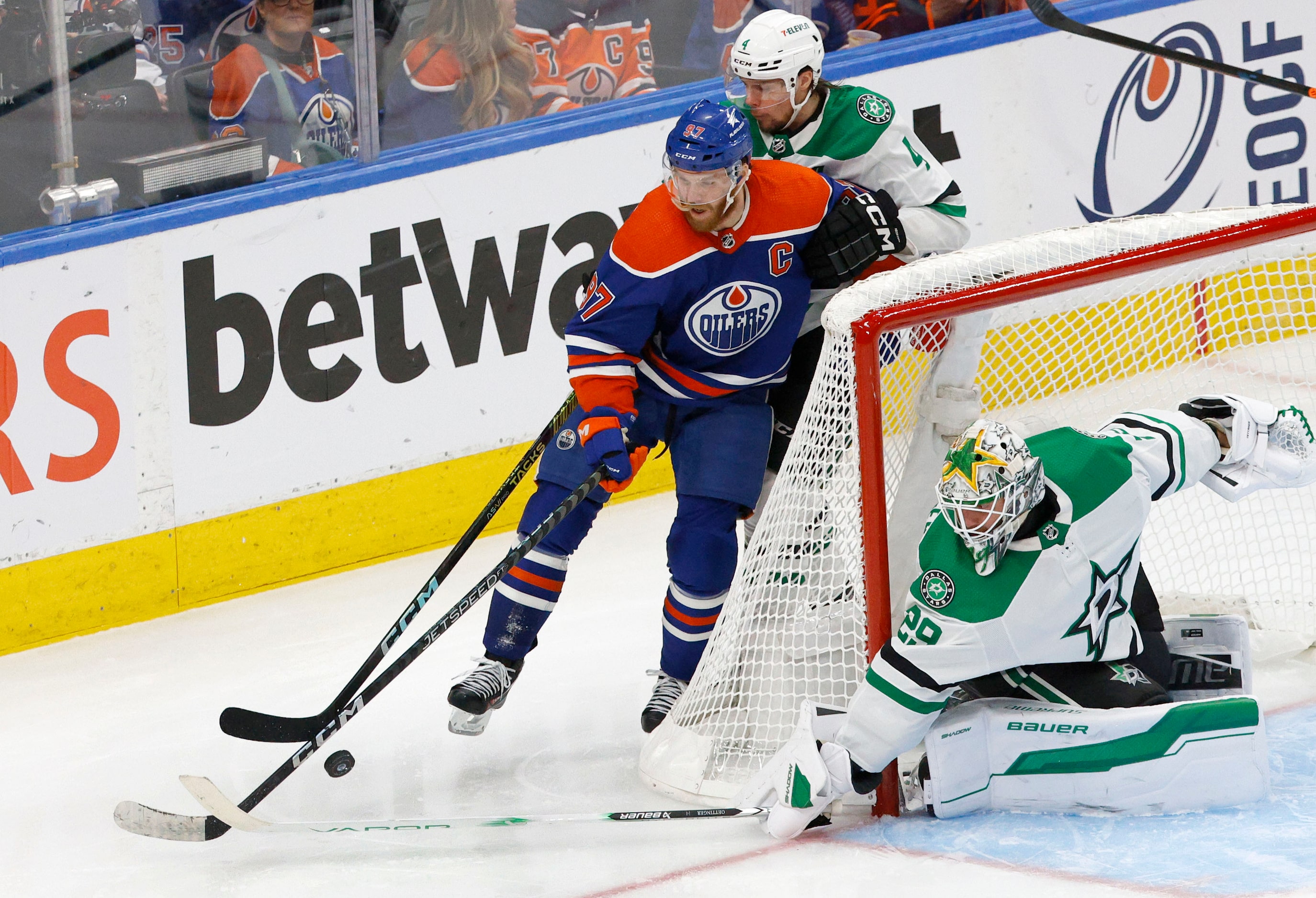 Edmonton Oilers center Connor McDavid (97) and Dallas Stars defenseman Miro Heiskanen (4)...