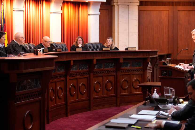 Attorney Eric Olson, far right, argues before the Colorado Supreme Court on Dec. 6, 2023, in...
