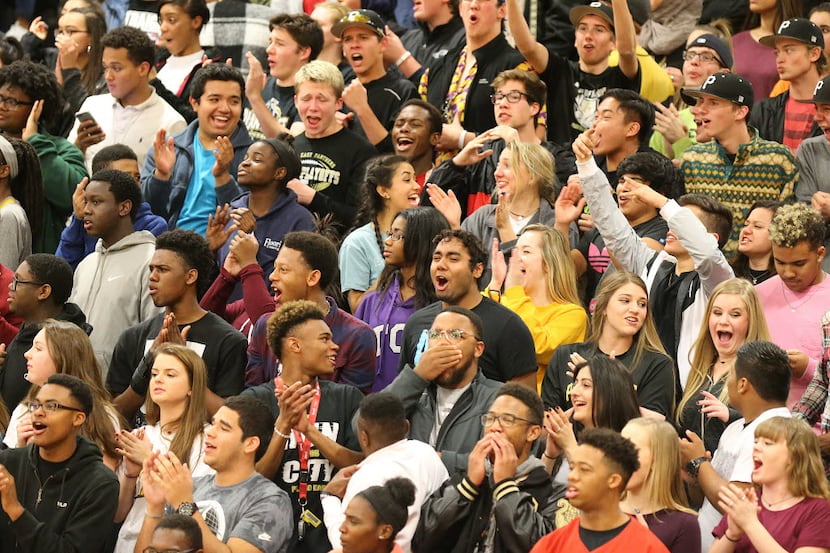 The Plano East High School student section reacts to a play during the second quarter of...