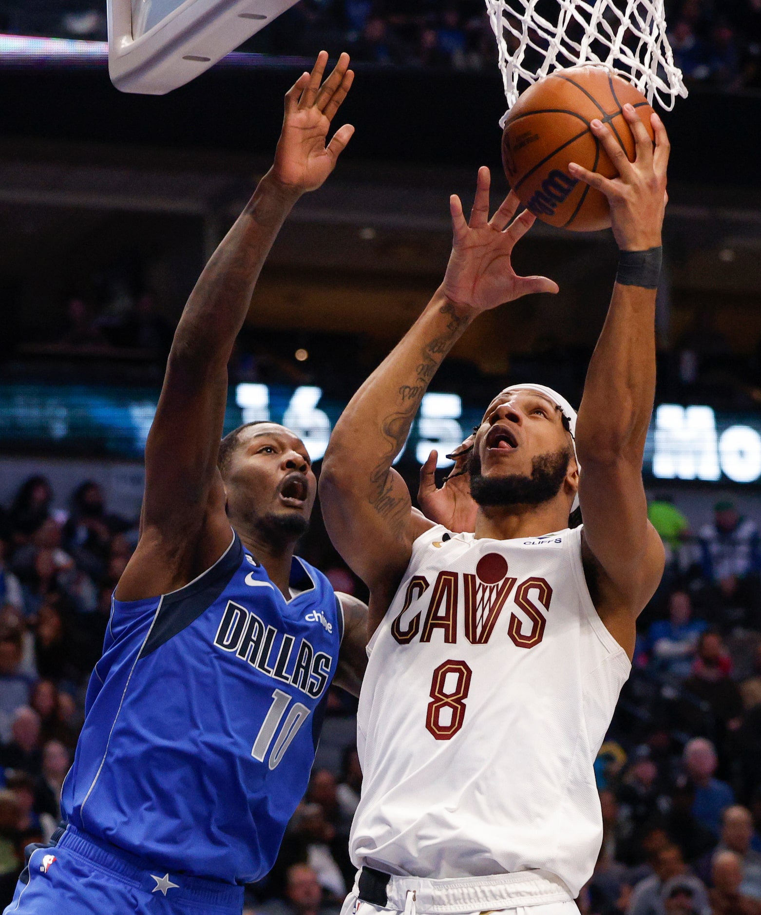 Cleveland Cavaliers forward Lamar Stevens (8) attempts a layup alongside Dallas Mavericks...