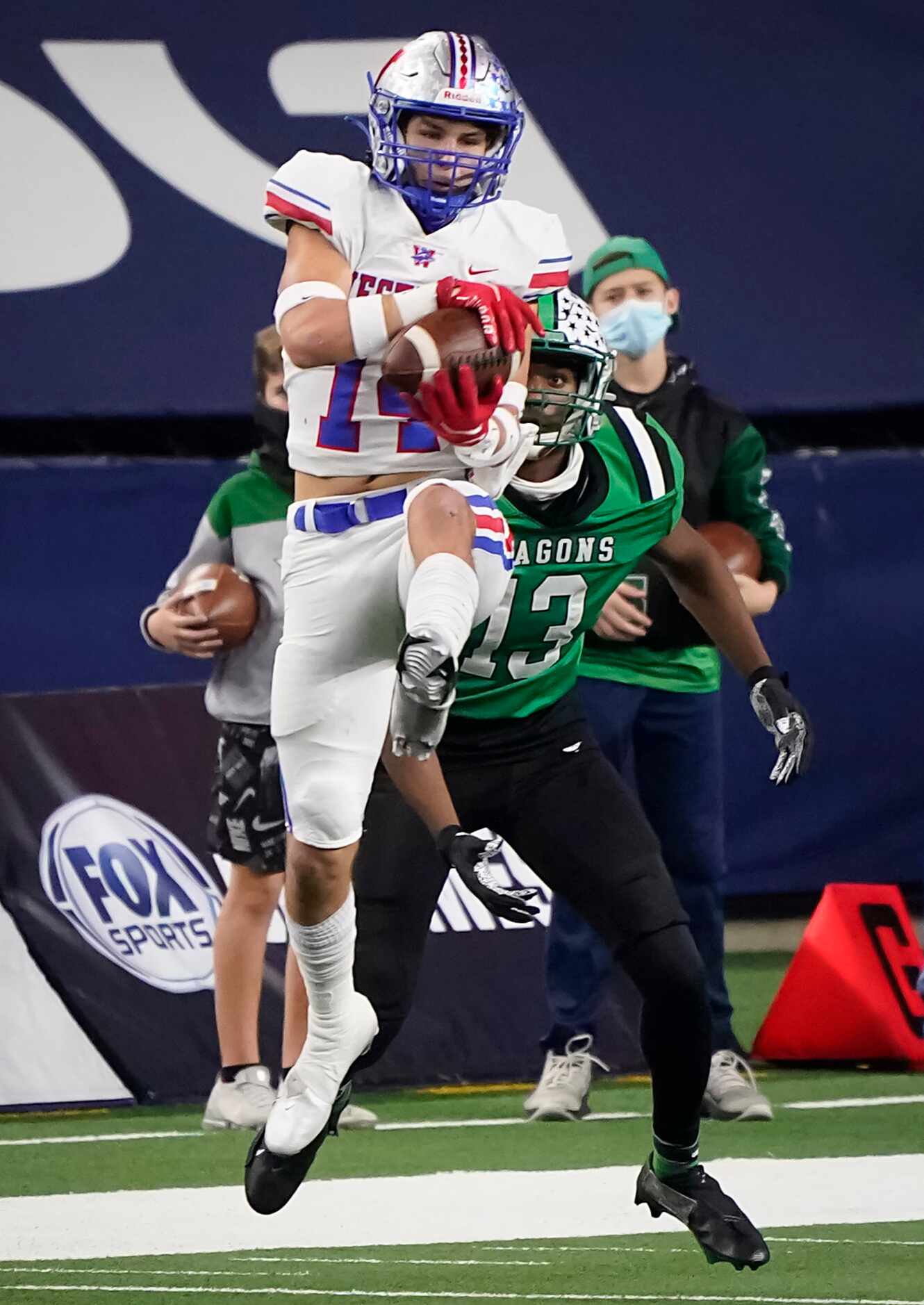 Austin Westlake defensive back Michael Taaffe (14) intercepts a pass intended for Southlake...
