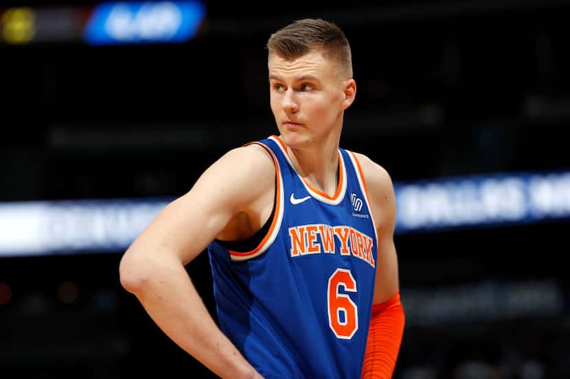 New York Knicks forward Kristaps Porzingis reacts after fouling out during the second half...