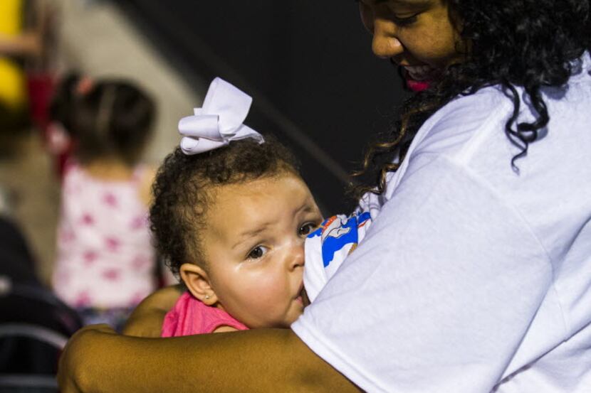 Tan McDowell breastfeeds her daughter Ava Ford, 11 months, during WIC's second annual Texas...