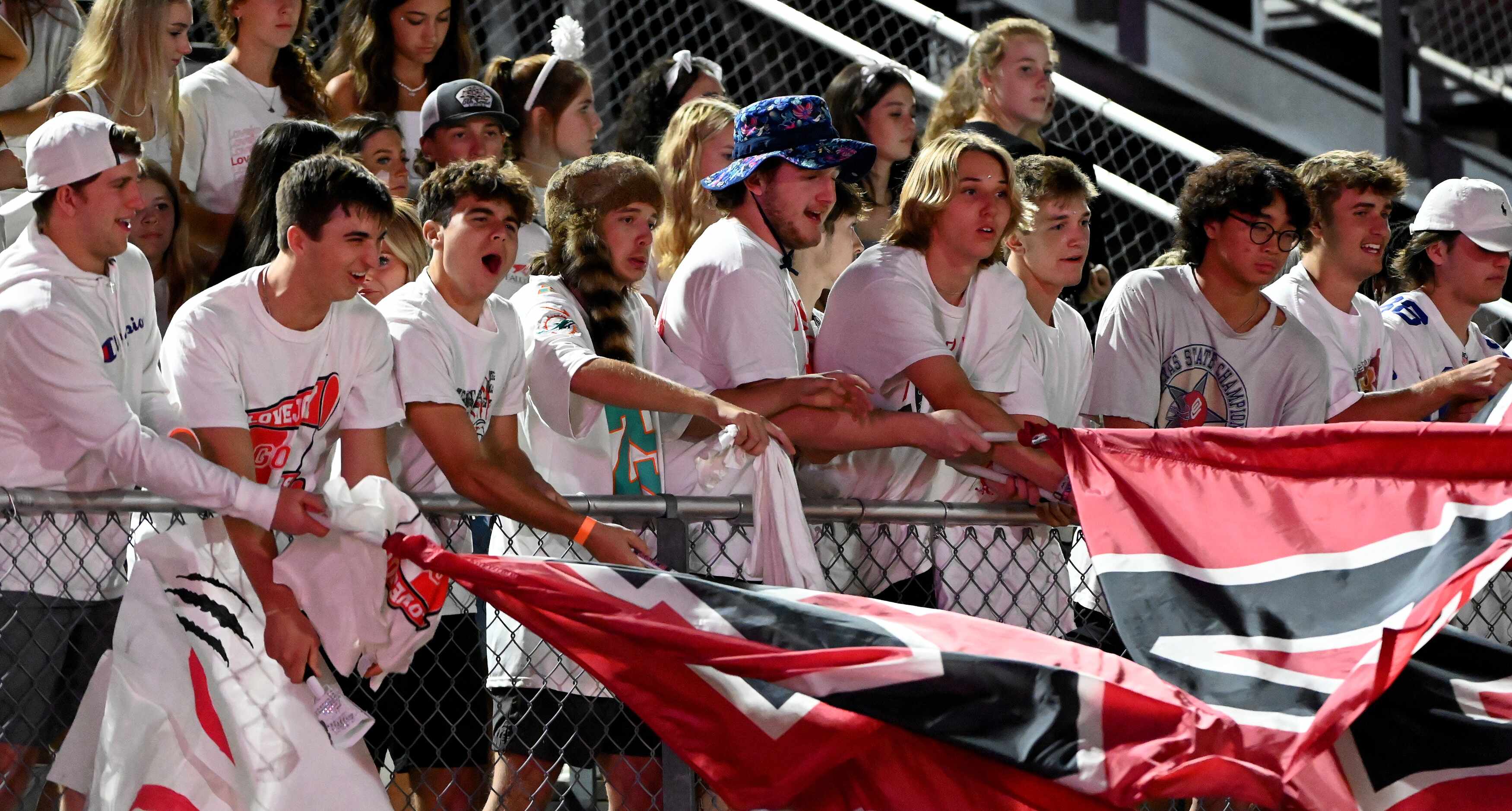 Lovejoy's students cheer in the first half of a high school football game between Frisco and...