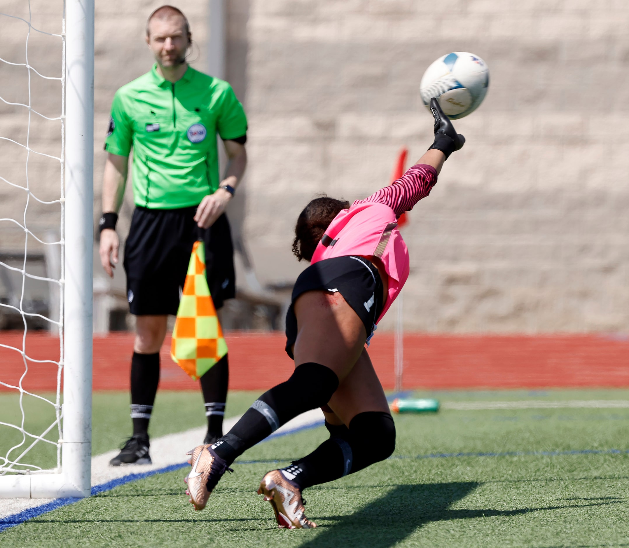 Frisco goalkeeper Ariana Anderson gets a hand on a Frisco Reedy shootout kick in the girls...