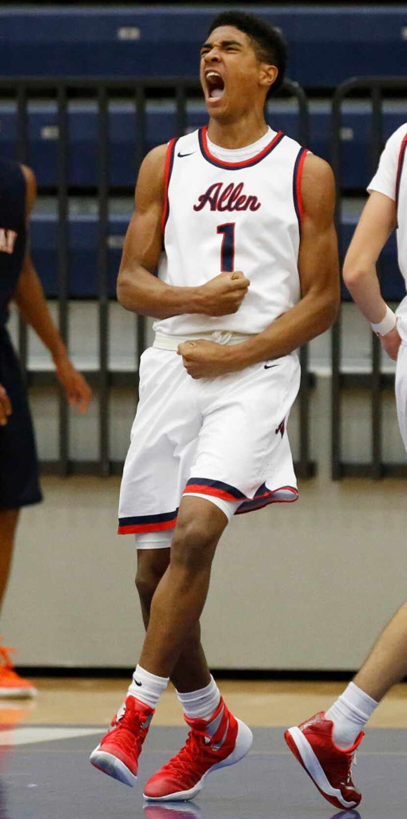 Allen forward Cam Christon (1) screams after scoring a dunk during the second quarter as...