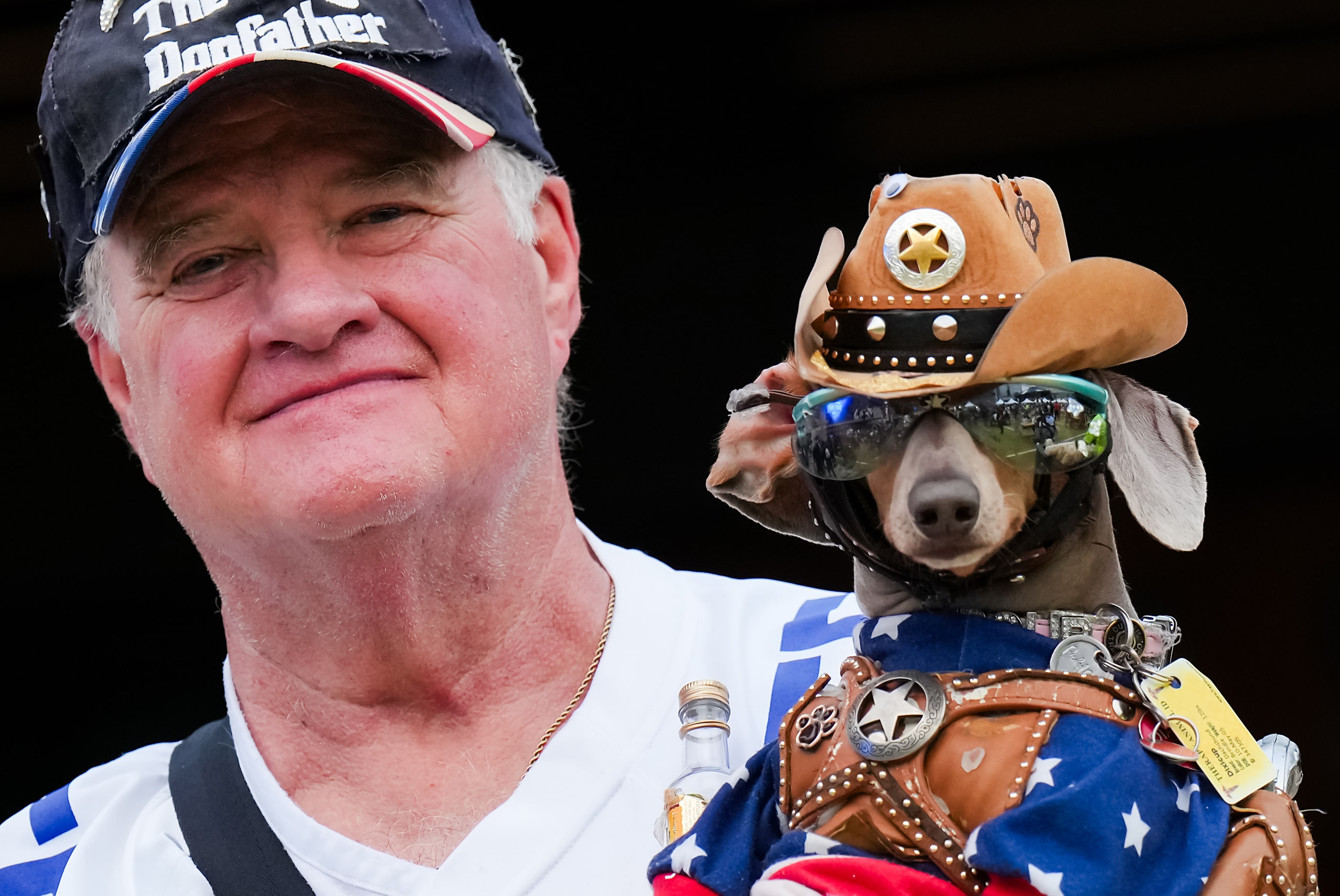 Dallas Cowboys fan Bob Ankrum brings his dog Buttercup to a draft party before the first...