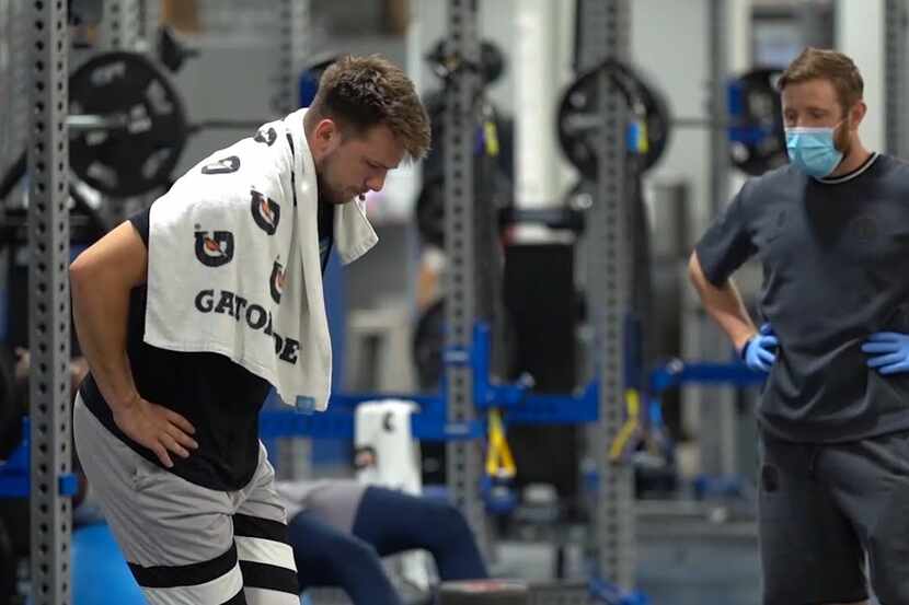 Dallas Mavericks guard Luka Doncic exercises during the team's mandatory workout on...