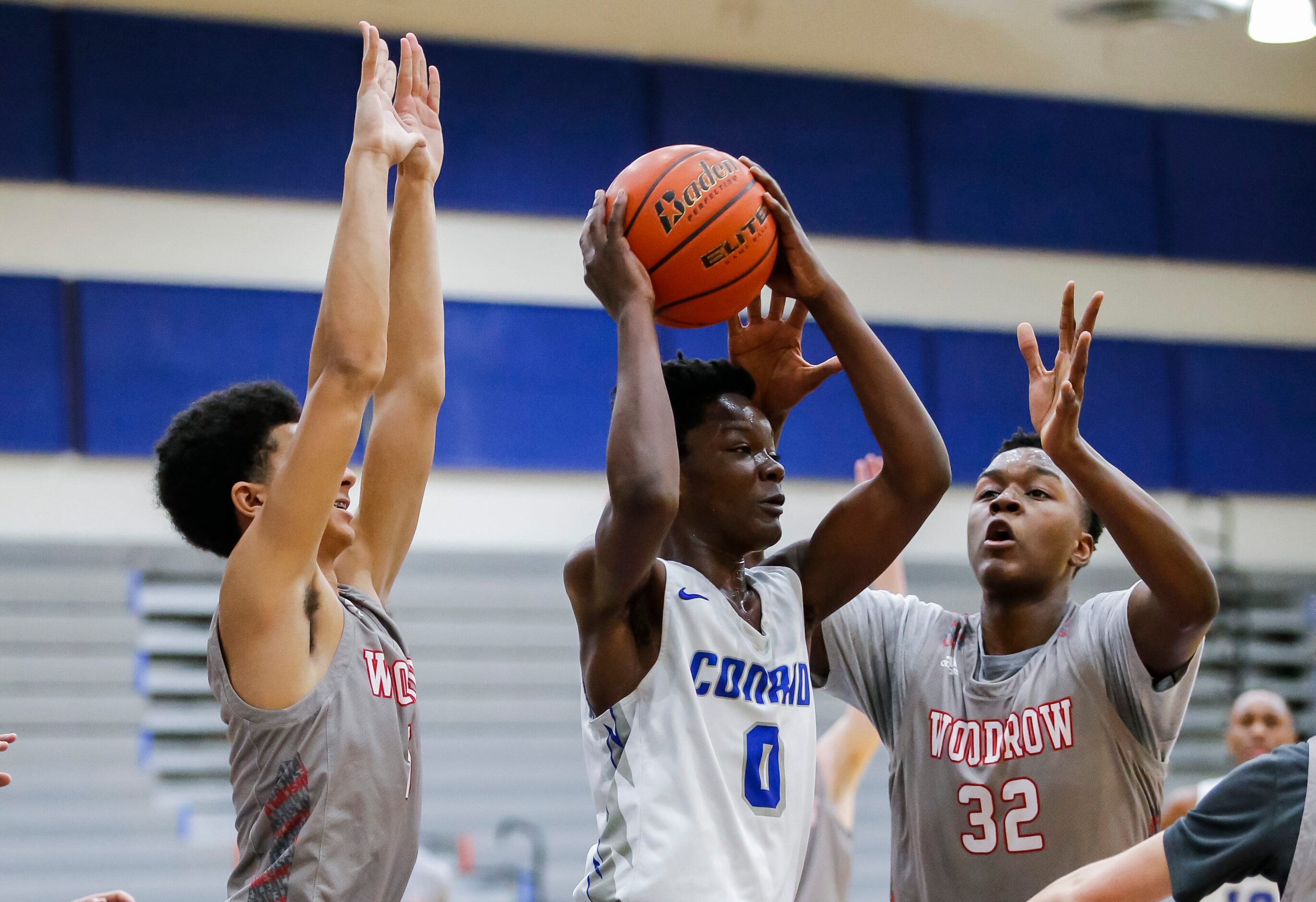 Conrad senior forward Joe Joe Yelegayhee (0) looks to pass as Woodrow Wilson junior forward...