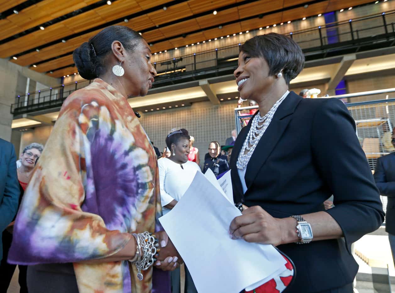 New Dallas Police Chief U. Renee Hall (right) shakes hands with Regina Joseph during a...