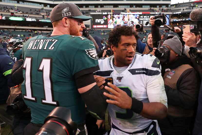 Seattle Seahawks quarterback Russell Wilson (3) shakes hands with Philadelphia Eagles...