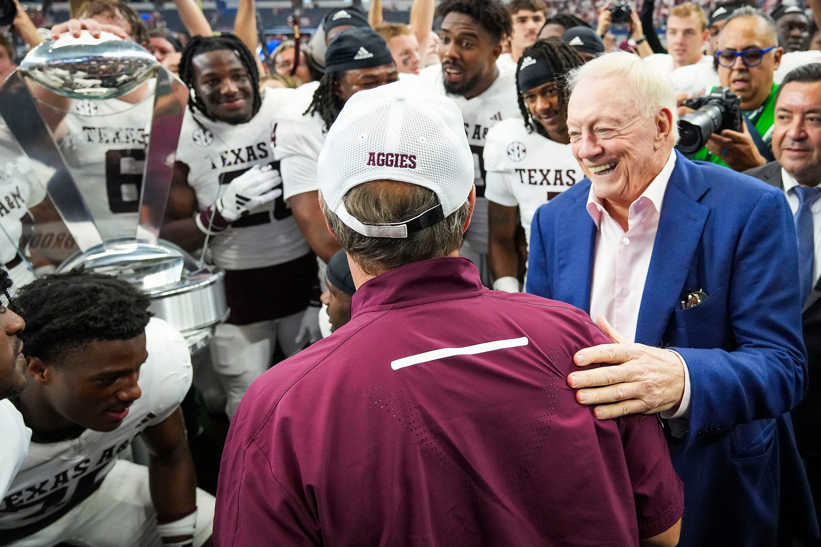 Dallas Cowboys owner and general manager Jerry Jones congratulates Texas A&M head coach...