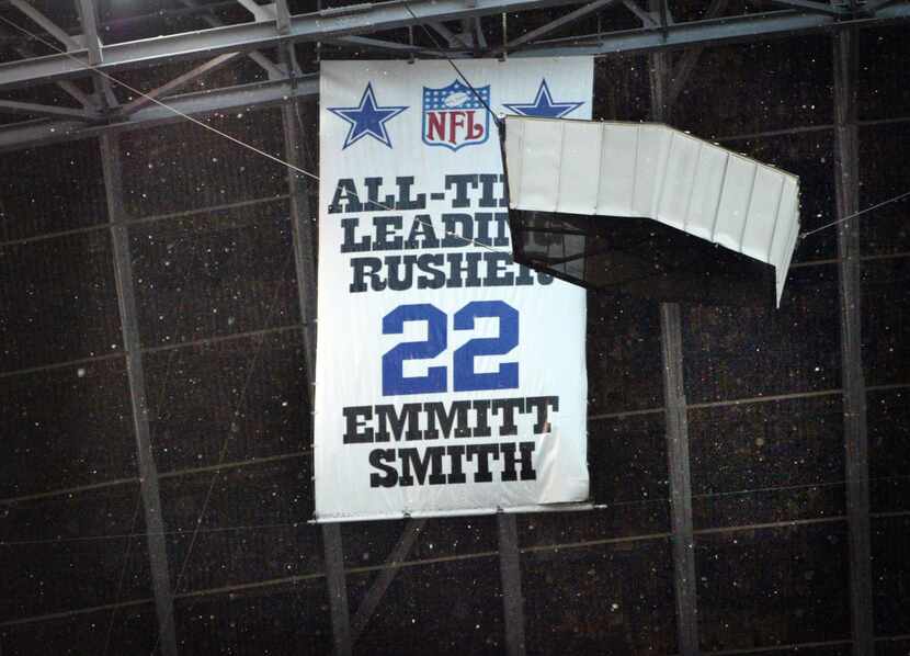 Snow falls on Emmitt Smith's All-Time Leading Rusher banner.