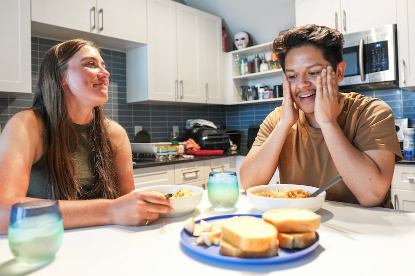 Natalie Taylor and Oscar Silva talk over dinner at their home on Monday, July 8, 2024, in...