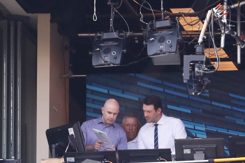 Tony Romo is seen in the broadcast boothbn before an NFL football game between the Green Bay...