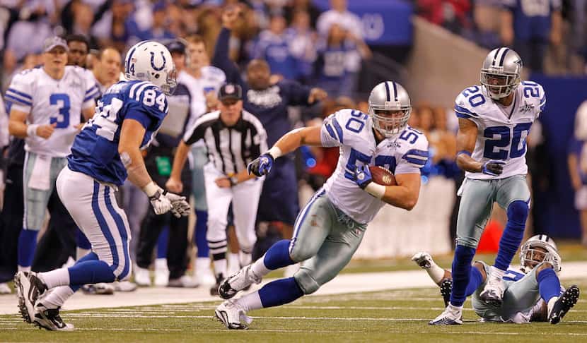 Dallas Cowboys linebacker Sean Lee (50) returns an intercepted Peyton Manning pass to the...