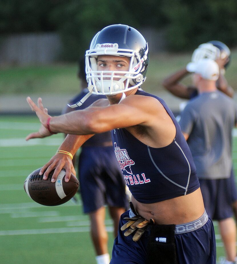 Ryan quarterback, Spencer Sanders, throws one while running drills on the first day of...