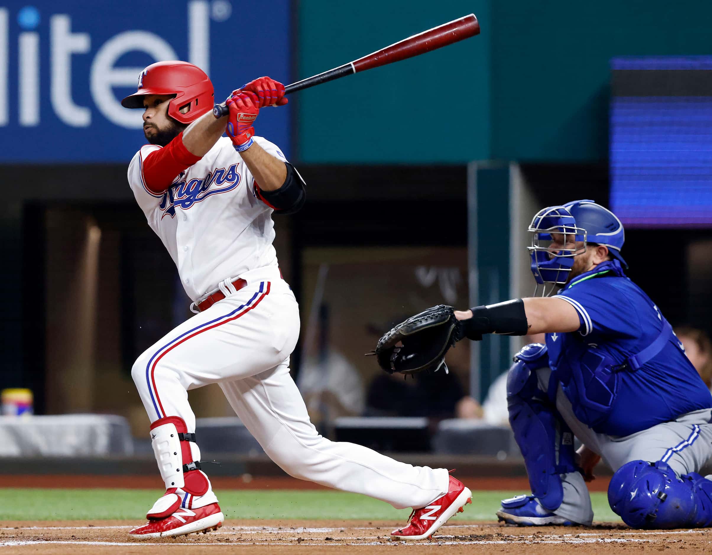 Texas Rangers Isiah Kiner-Falefa (9) connects on a double during first inning against the...