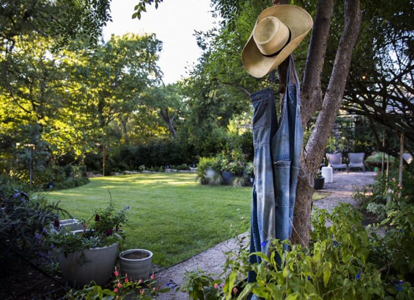 
Patrick’s gardening overalls hang where he peels them off after a sweaty day’s work....