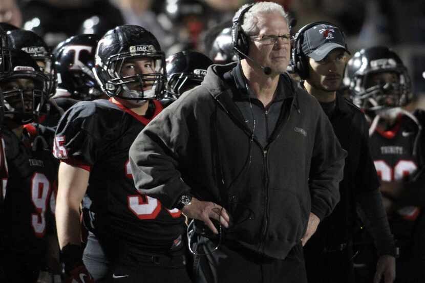 Euless Trinity head coach Steve Lineweaver watches intently from the team sidelines as the...