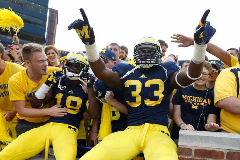 ANN ARBOR, MI - AUGUST 31: Taco Charlton #33 of the Michigan Wolverines and Blake Countess...