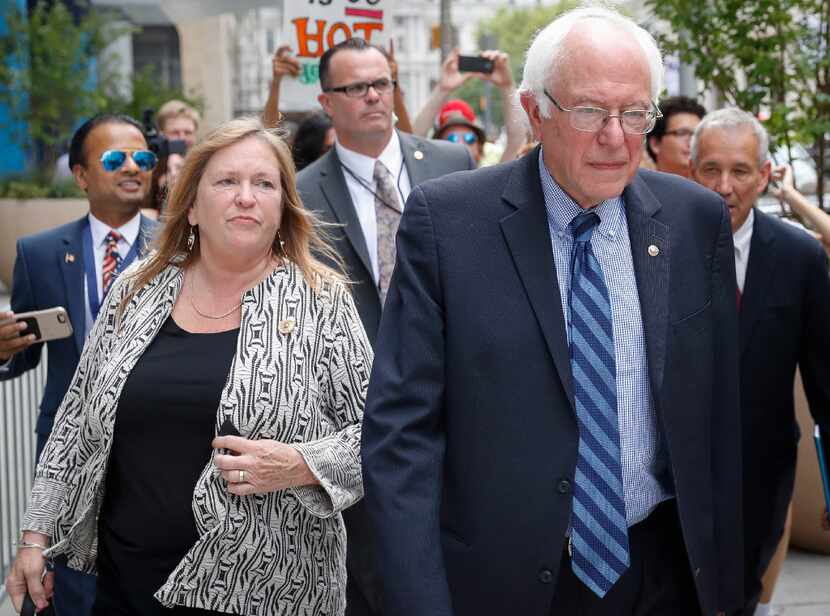 In this July 28, 2016 file photo, Sen. Bernie Sanders, I-Vt. and his wife Jane walk through...