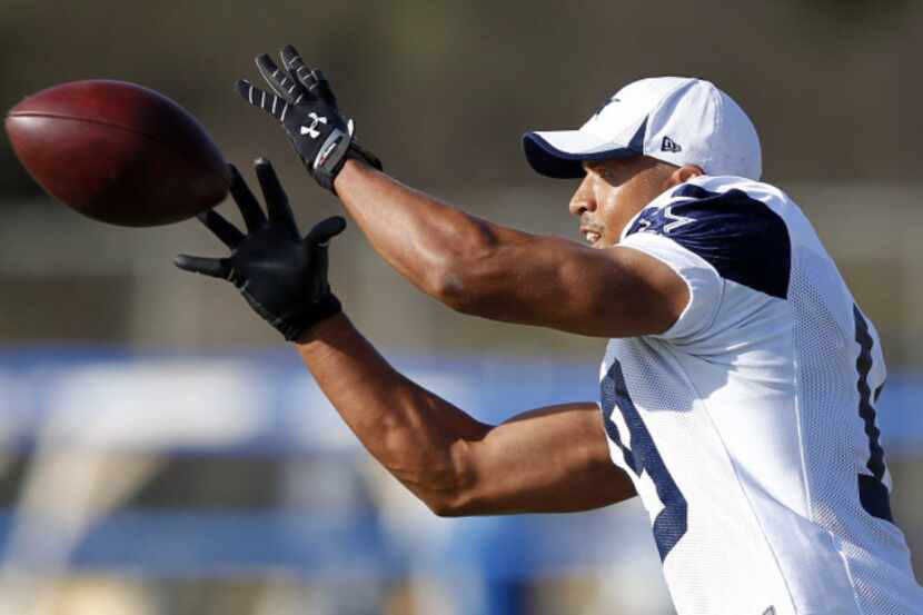 Dallas Cowboys wide receiver Miles Austin (19) catches a pass during the afternoon practice...