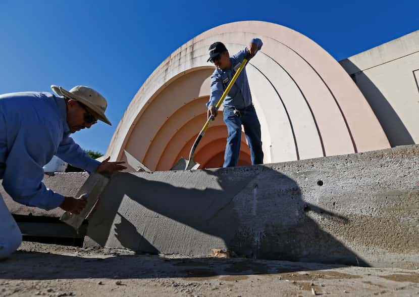 City of Dallas employees worked Thursday on the retaining wall around the orchestra pit in...