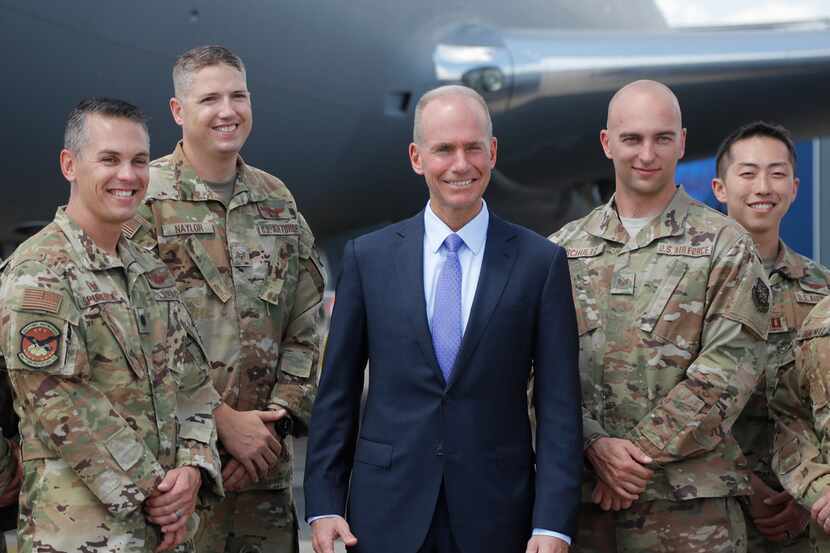 Boeing Chief Executive Dennis Muilenburg posed Monday with crew members of a Boeing KC-46...