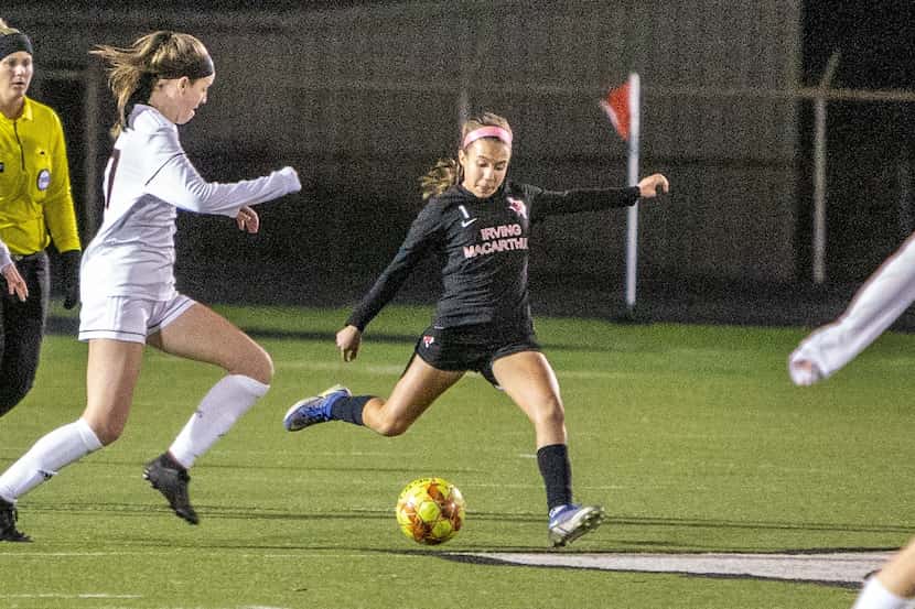 Irving MacArthur midfielder Ana Cedeno (No. 1) looks to make a pass during a soccer match...