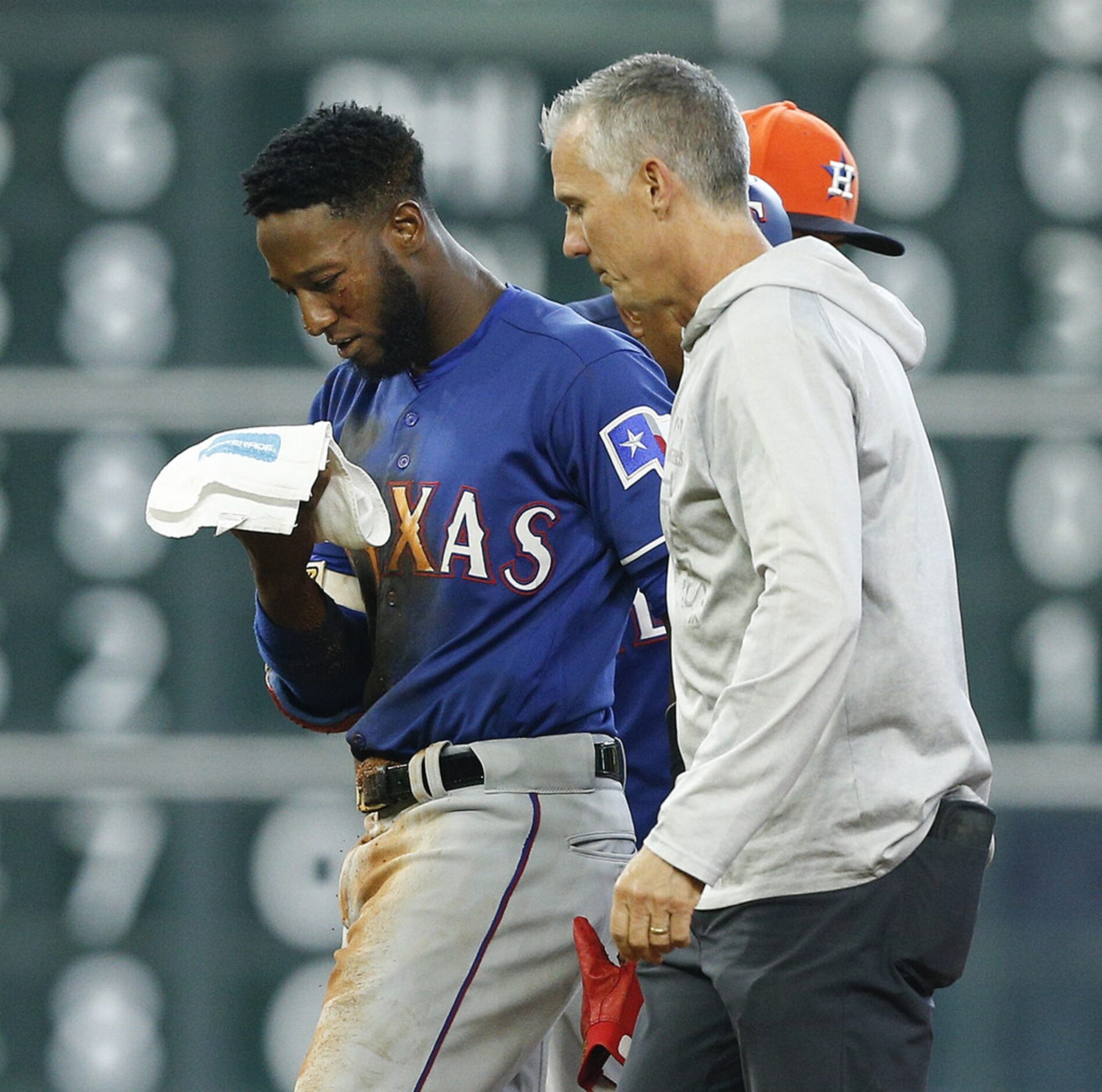 HOUSTON, TX - JULY 29:  Jurickson Profar #19 of the Texas Rangers is helped off the field...