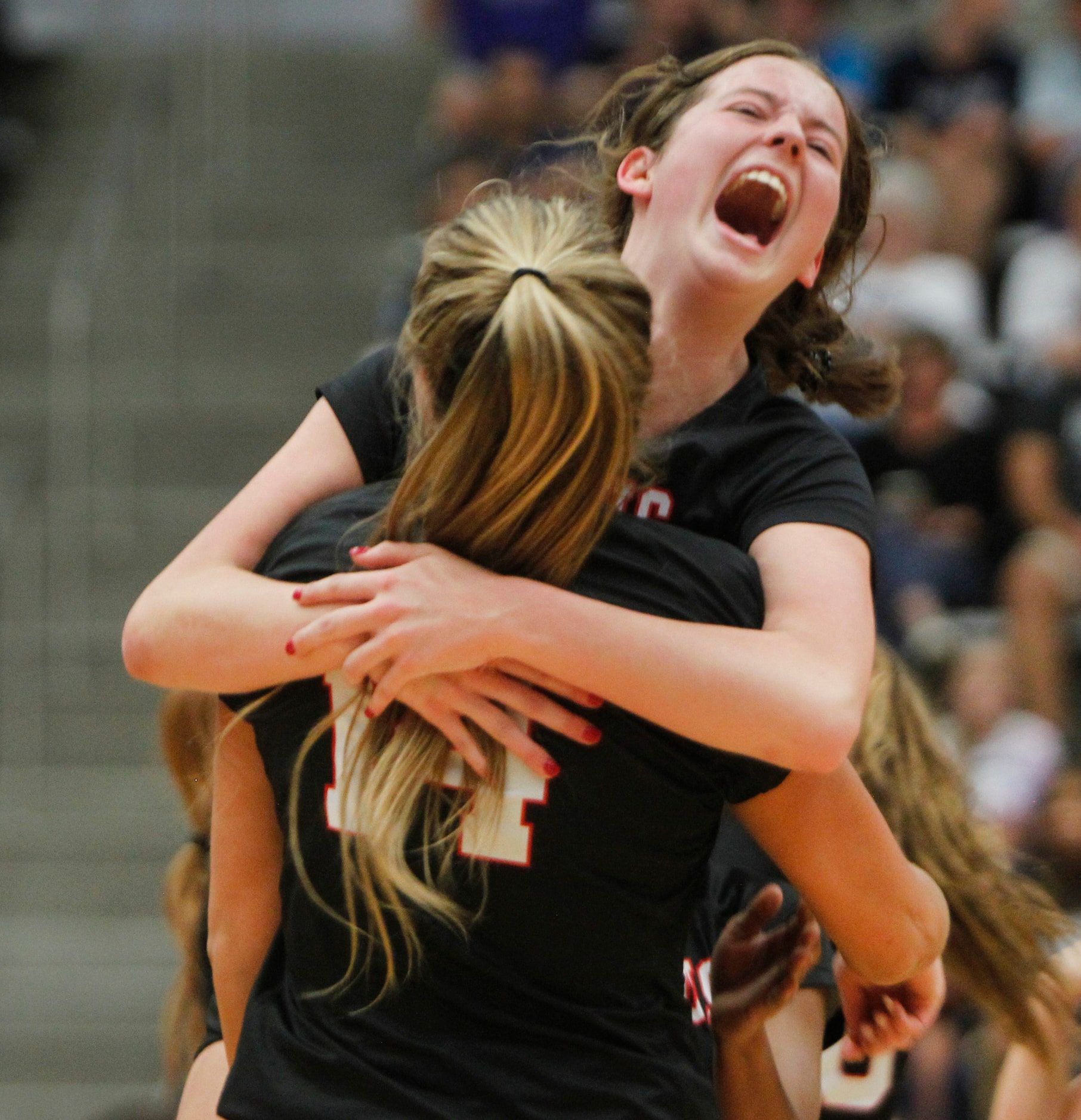 Flower Mound Marcus' Lexi Godbey (11) exults as she leaps to congratulate teammate Maggie...