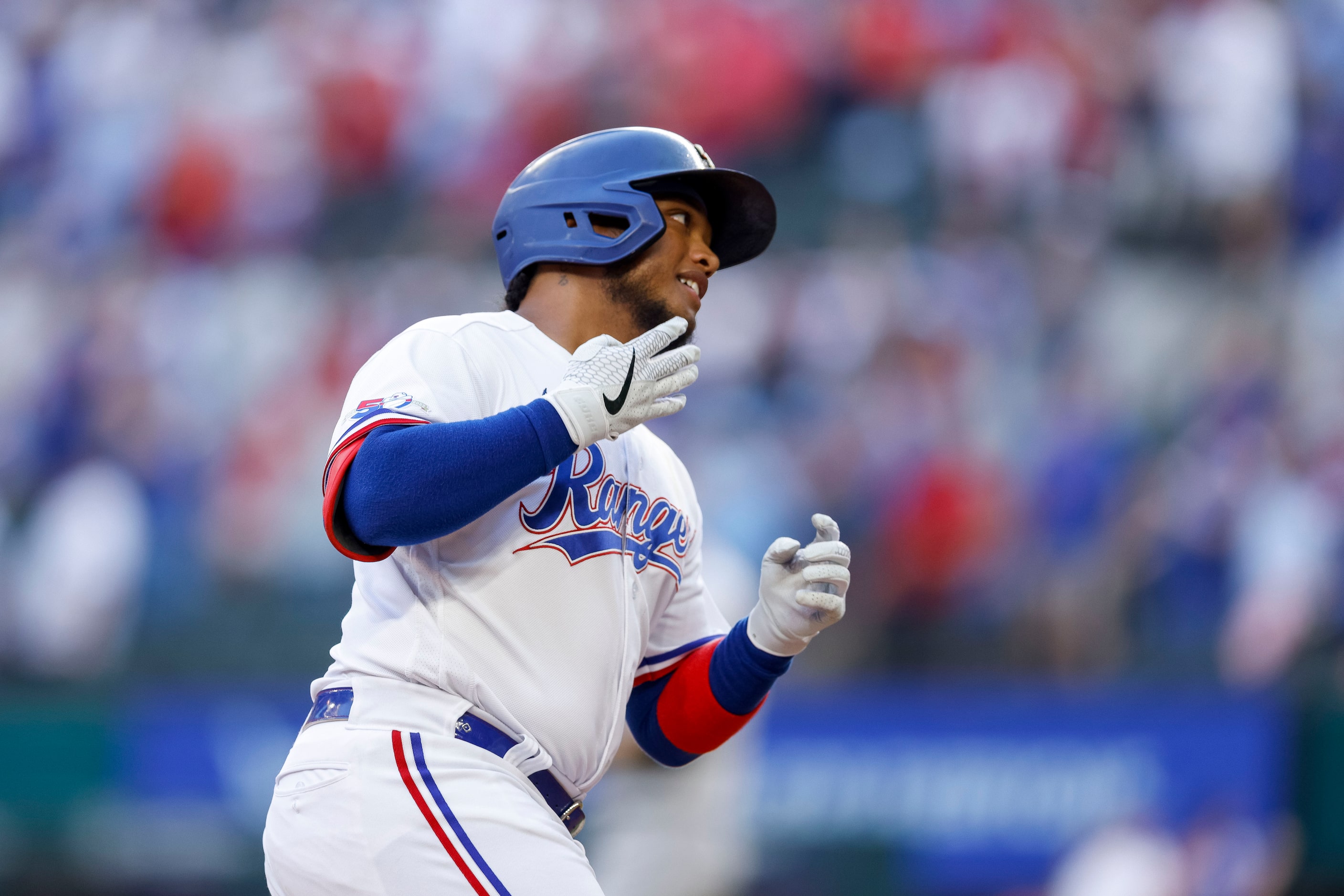 Texas Rangers left fielder Willie Calhoun (4) celebrates his game-tying home run during the...