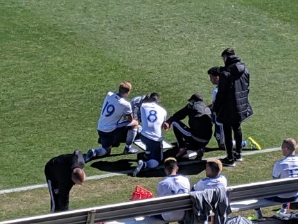 FC Dallas coach Luchi Gonzalez talks over shape & tactics with his midfield at halftime...